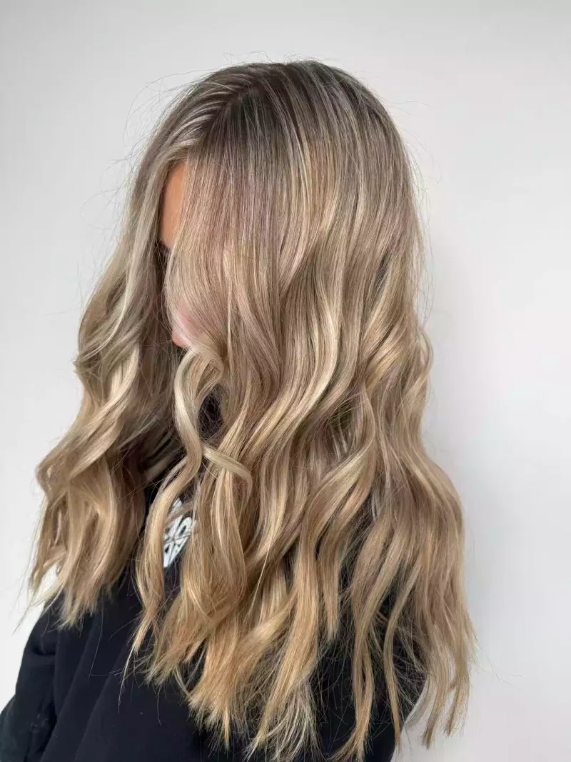 Blonde lived-in color on natural curls